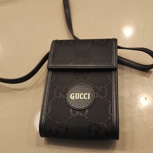 Never used brand new Gucci large GG phone messenger in black!! Dust Bag included